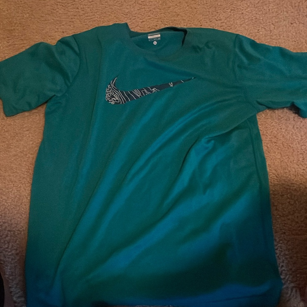 Green-ish Nike shirt